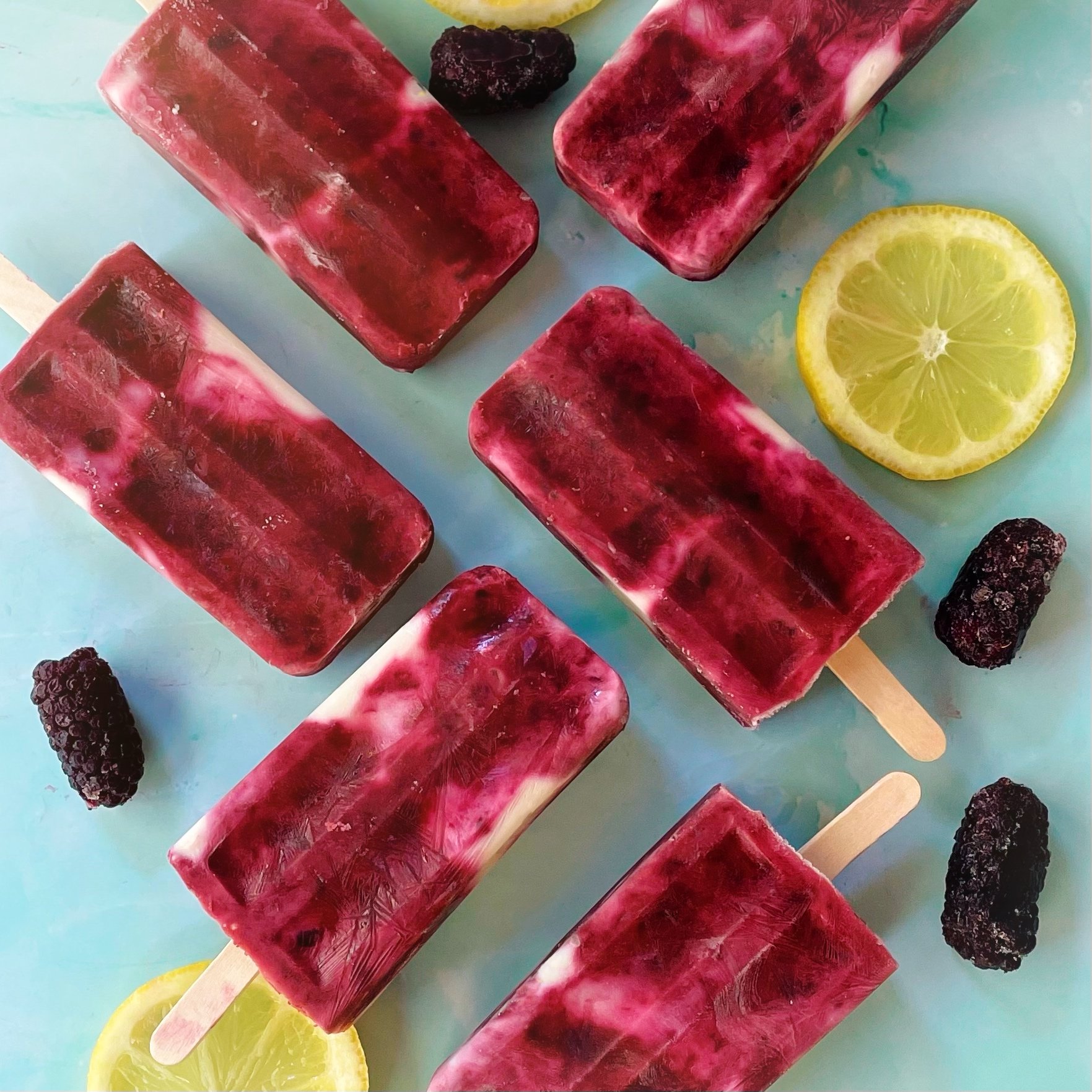 Homemade blackberry cheesecake popsicles made with fresh blackberries, dairy free yogurt, lemon juice and honey for a delicious and easy to make summertime frozen snack.