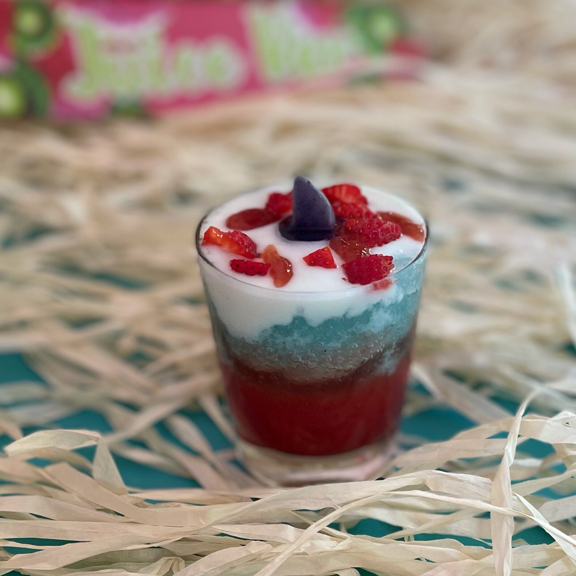 Shark attack drink for shark week party idea. Fun shark attack mocktail with three layers that look like the ocean.