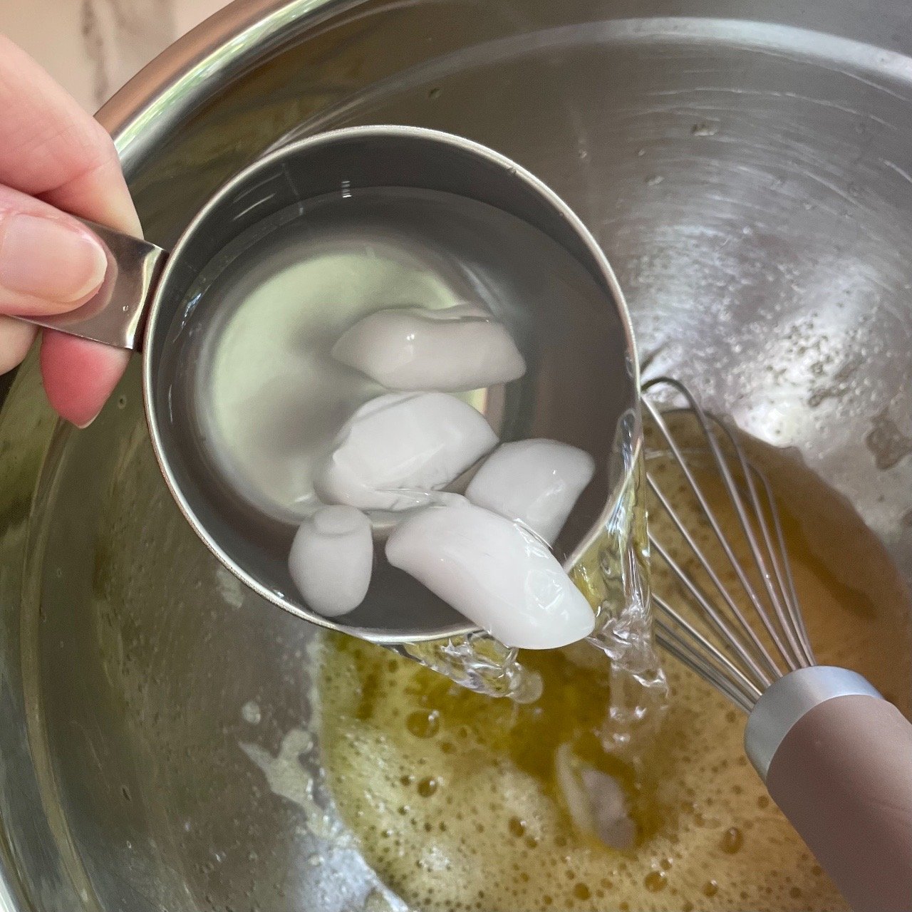 Making filling for lemon fluff icebox dessert bars.